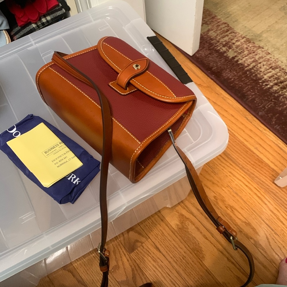 Dooney& Bourke pebbled cranberry & saddle leather. New with bag and card.